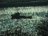 Barco en el sol poniente